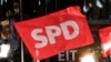 Germany - Social Democratic Party (SPD) supporters react after first exit polls for the general elections in Berlin, Germany, September 26, 2021